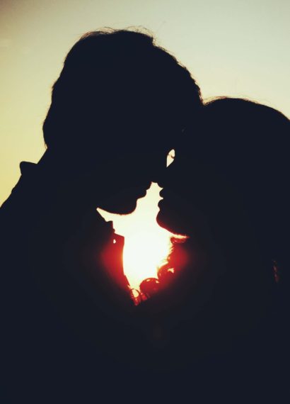 silhouette of a man and woman about to kiss